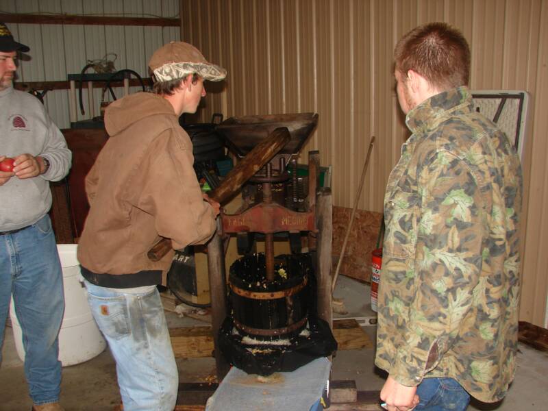 Jacob and Leroy making apple cider