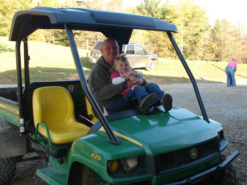 Abby and "Gumpy" sitting on the Gator